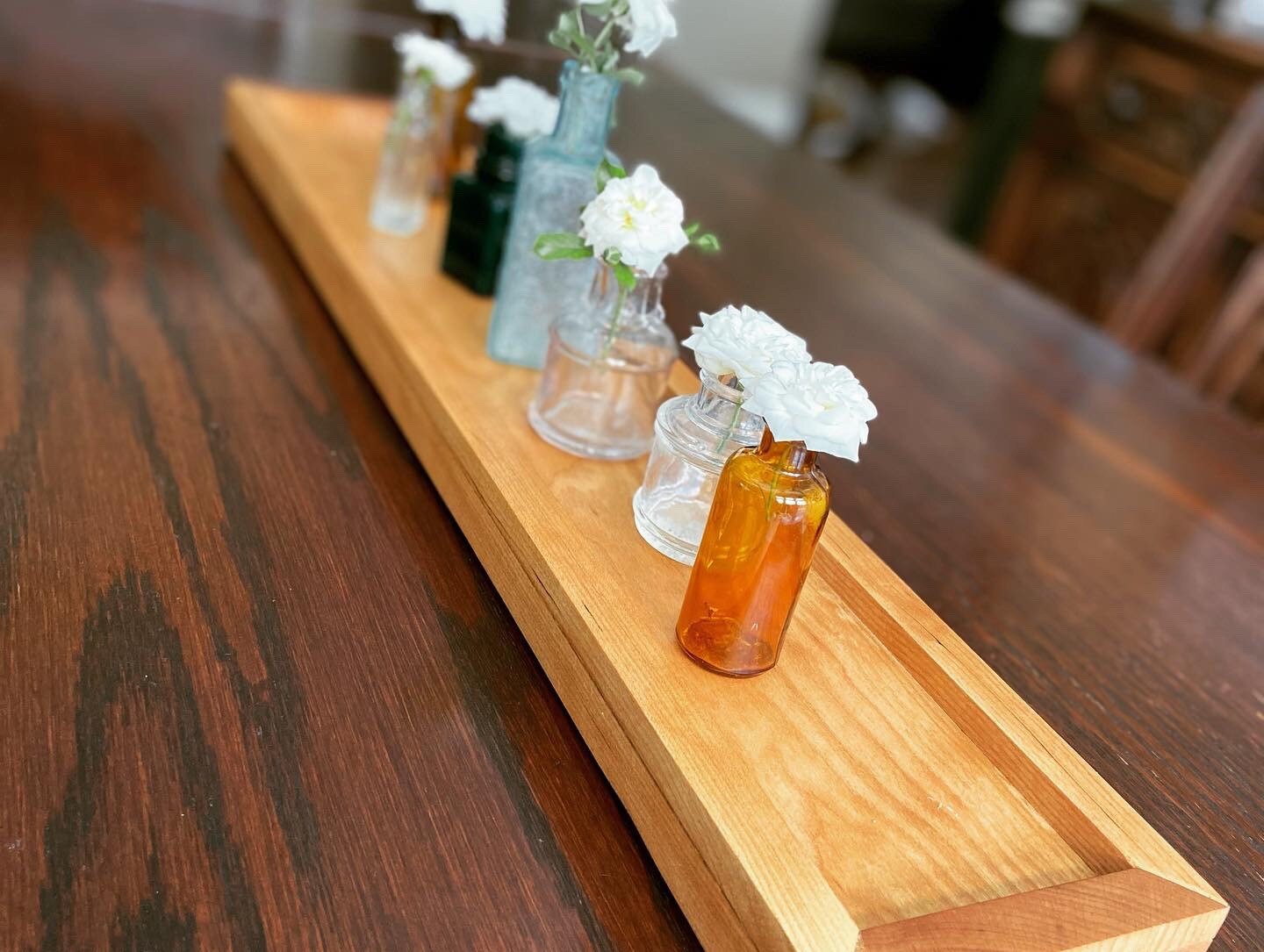 Cherry tray with miniature ink bottles for vases