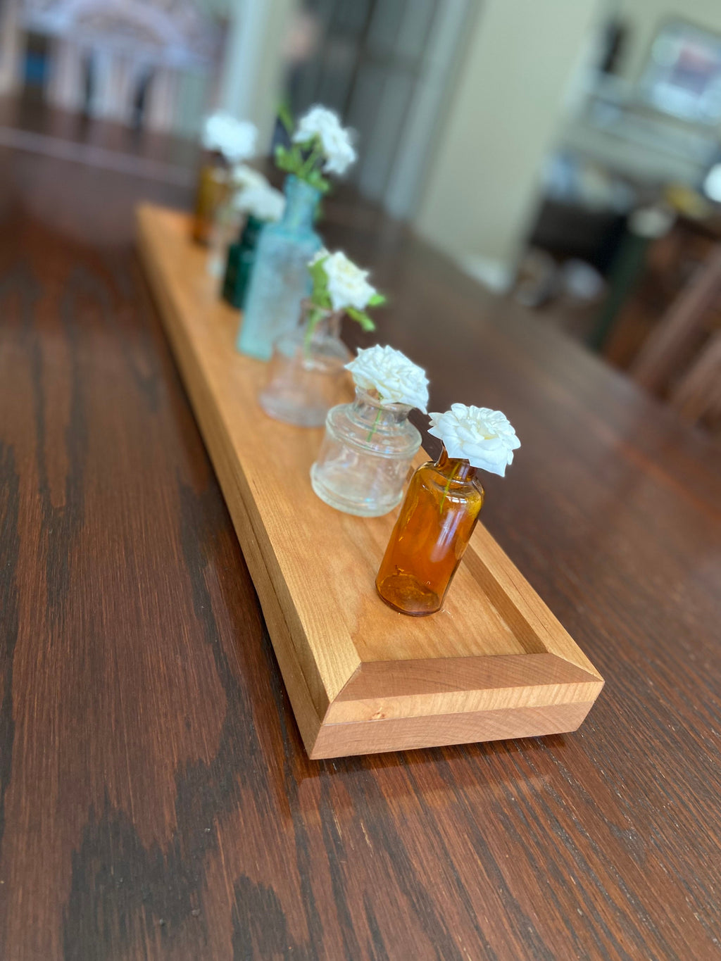 Cherry tray with miniature ink bottles for vases