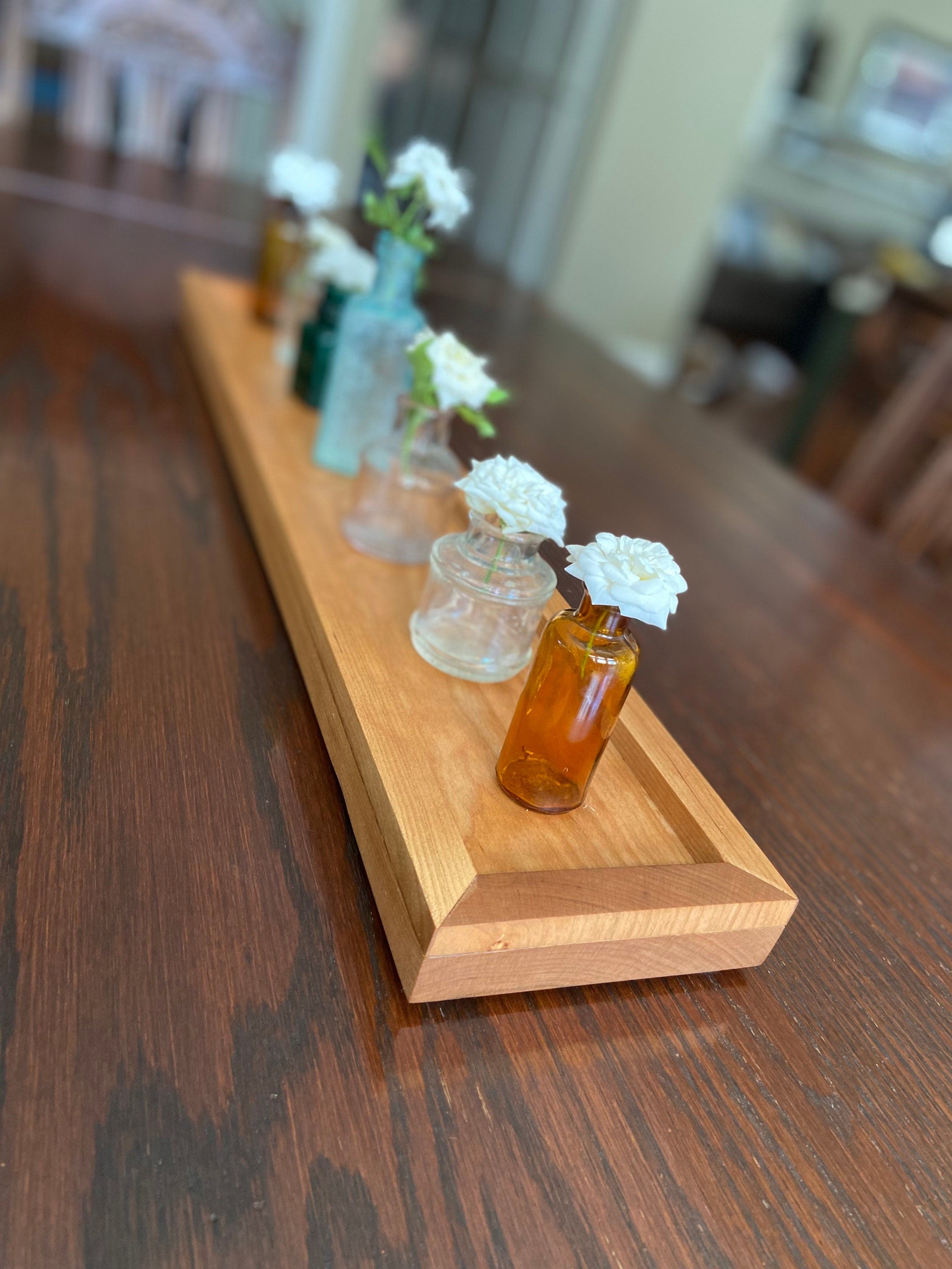 Cherry tray with miniature ink bottles for vases